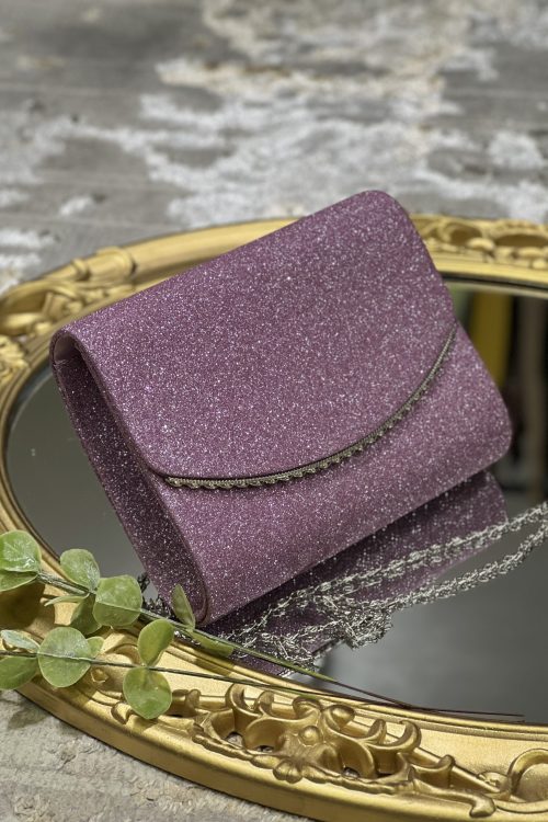 Hermoso clutch color malva y ribete plateado